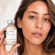 Silk Peptide EGF serum bottle held beside the face